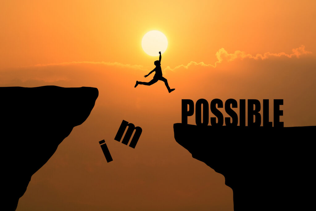 man jumping impossible possible cliff sunset background business concept idea