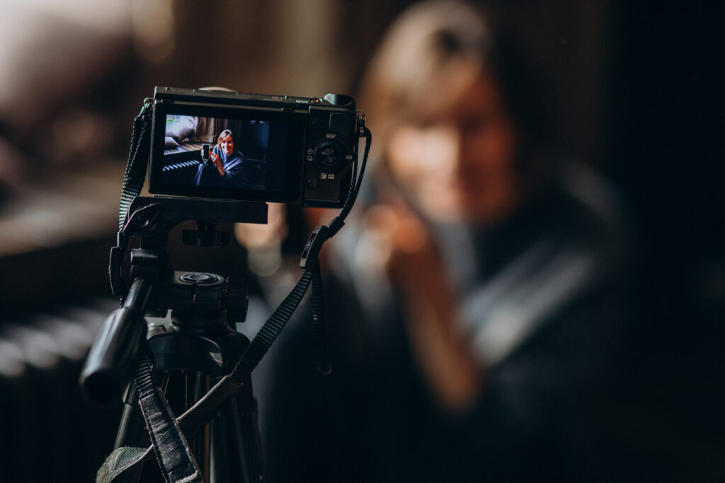 young video blogger making video review her vlog